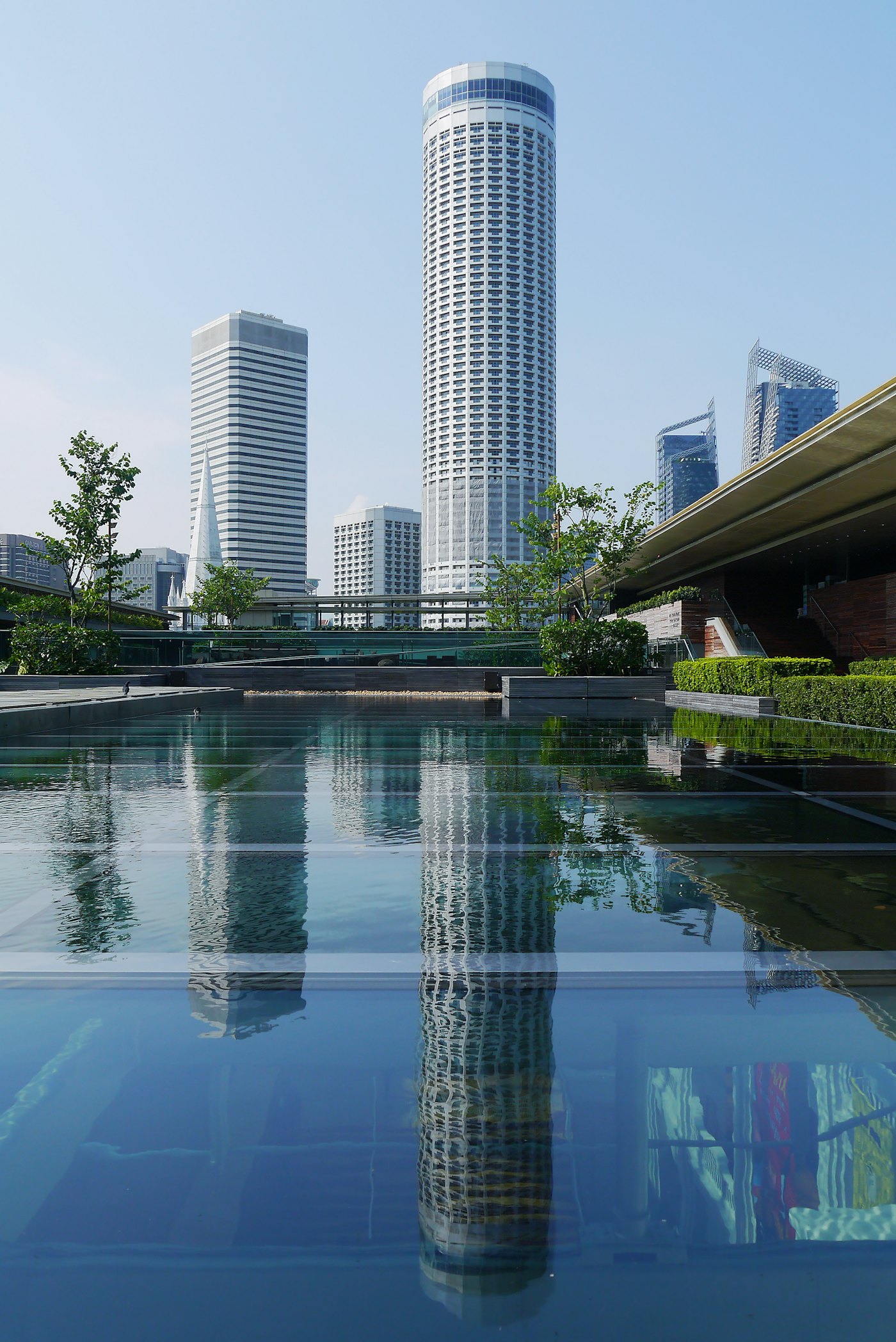 Singapore towers reflected in still water